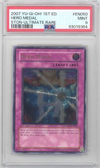 PSA 9 - Yu-Gi-Oh Card - STON-EN050 - HERO MEDAL (ultimate rare holo) *1st Edition* - MINT